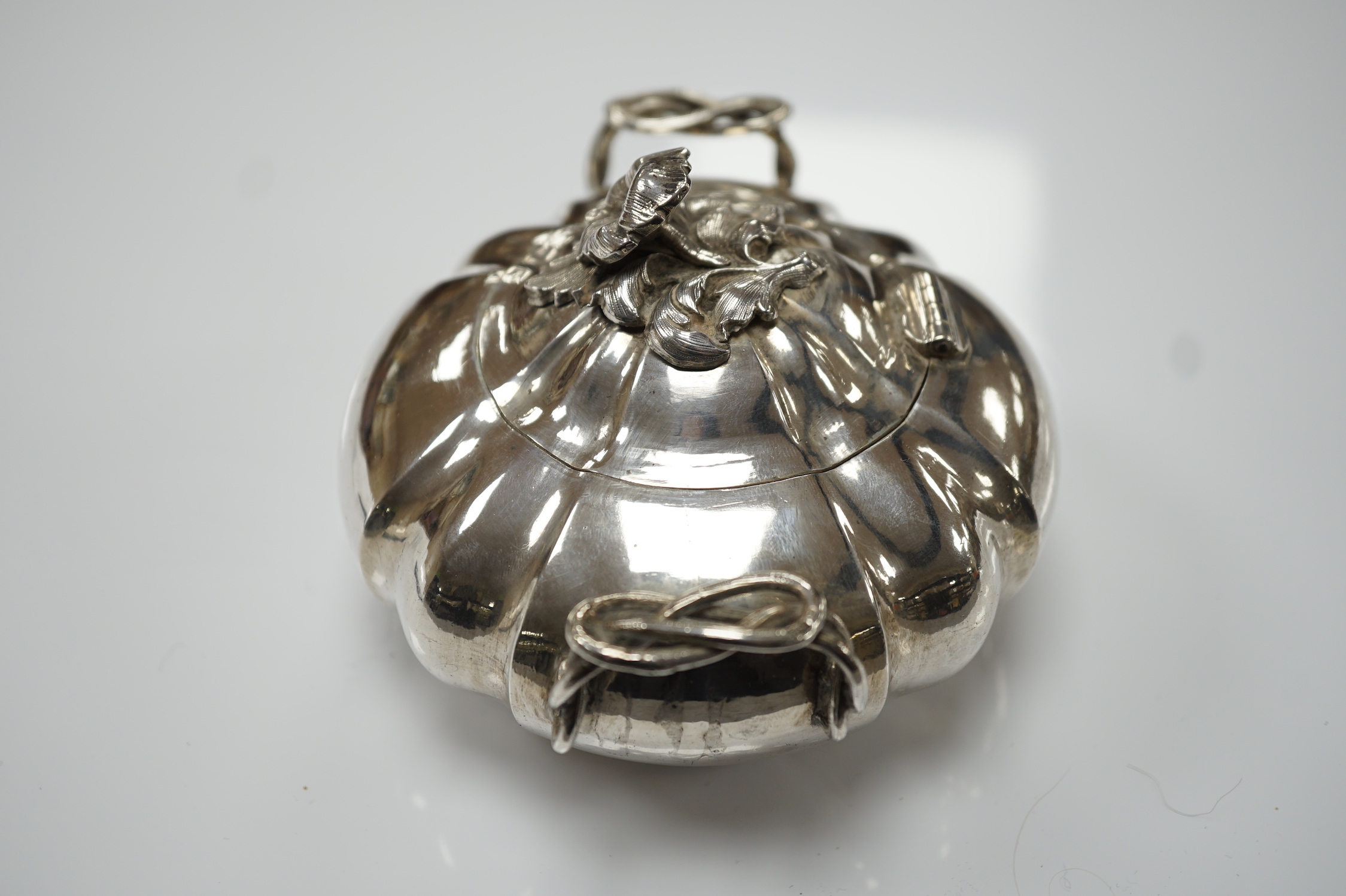 A mid 19th century Russian 84 zolotnik two handle sugar bowl and hinged cover, assay master possibly Vasily Surotsov, width over handles, 13.5cm, 10oz.